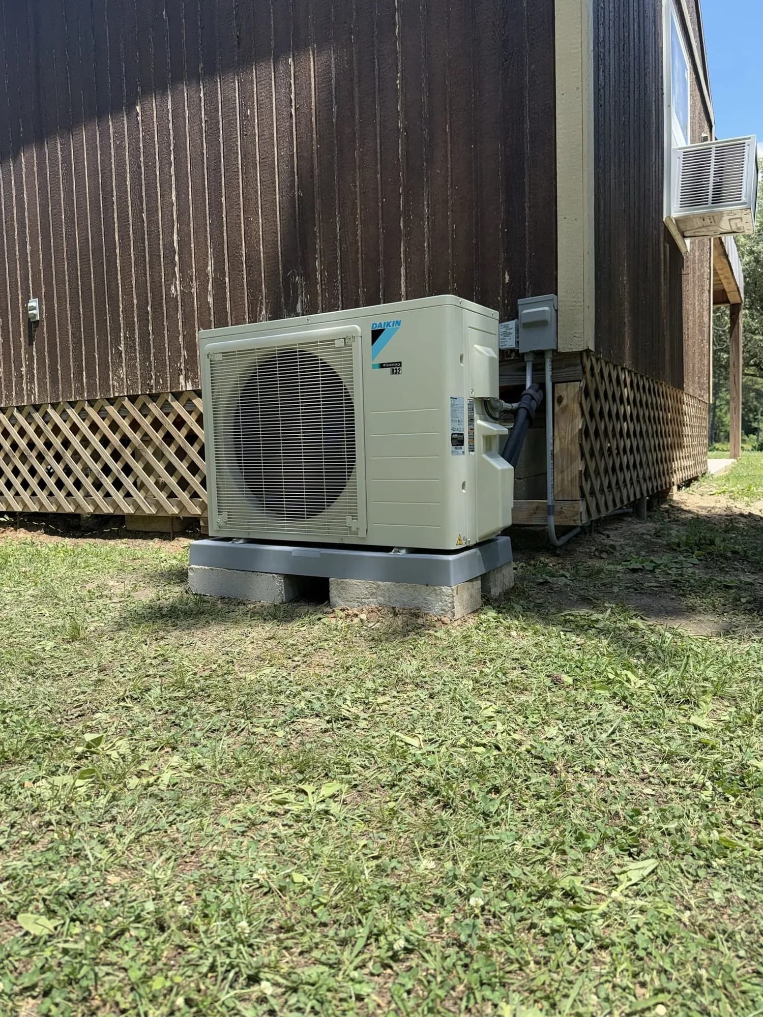 Outdoor condenser installed on a residential lot