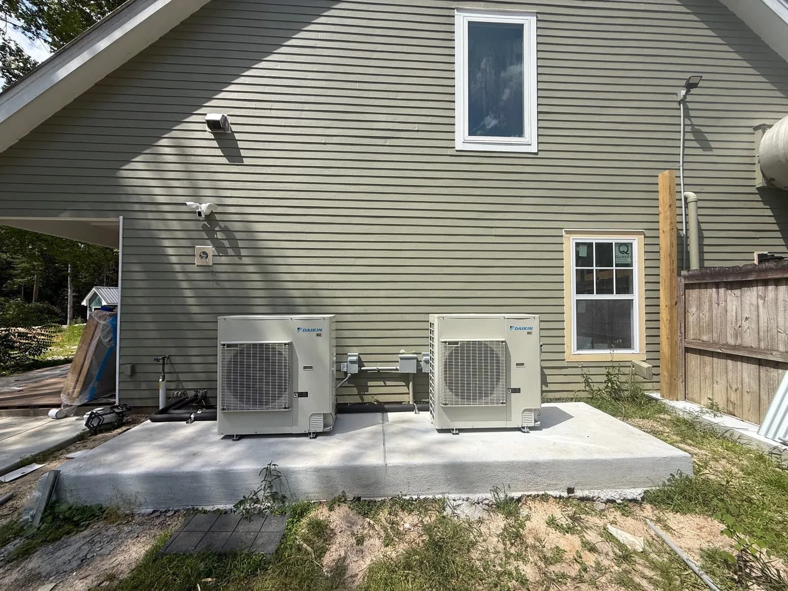 Two mini-split condensers on a new pad